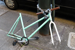 Bike frame only thing left of chained up bicycle San Francisco 20190313-183705 cw50 C4