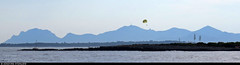 20170715_05 Parasailers, tall plants, & blue mountains seen from Billionaire Bay, Antibes, France