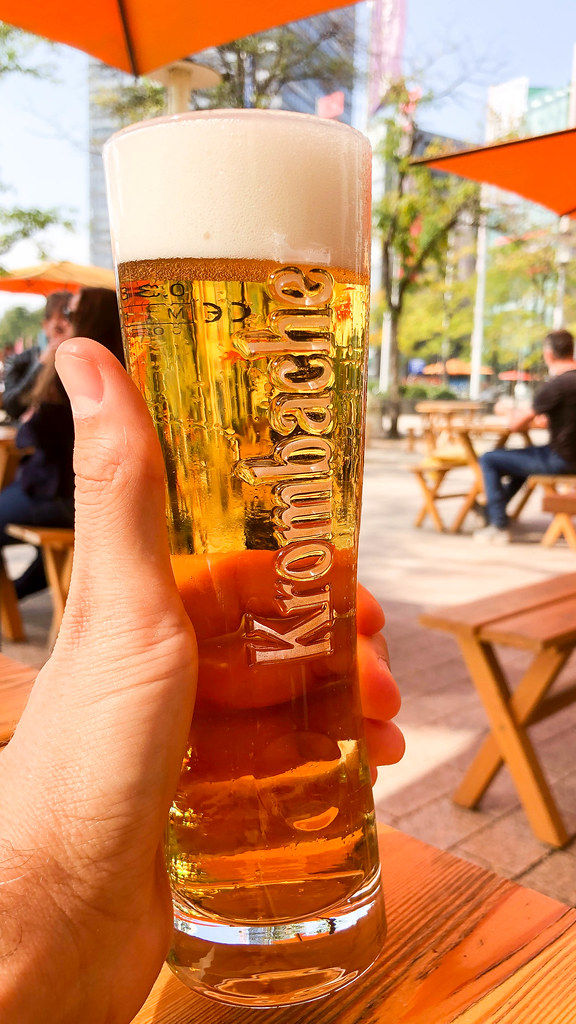 Cheers! A Krombacher draft beer on a sunny day at the Media Park in Cologne