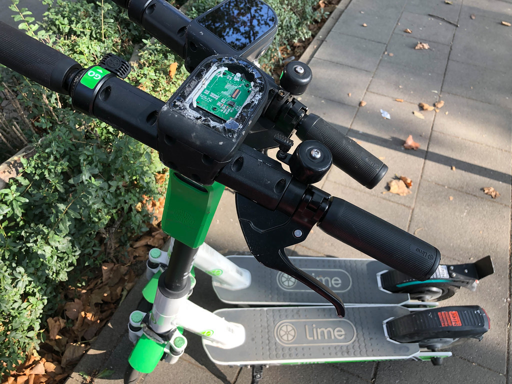 Vandalism: one of two Lime electric scooters with destroyed display on the street in Cologne
