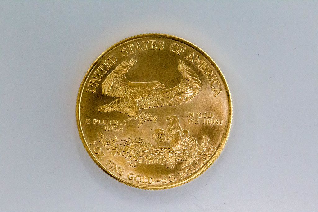 US-Dollar Eagle 2020 gold coin as collector's item shows bald eagle with olive branch by Miley Busiek on the back