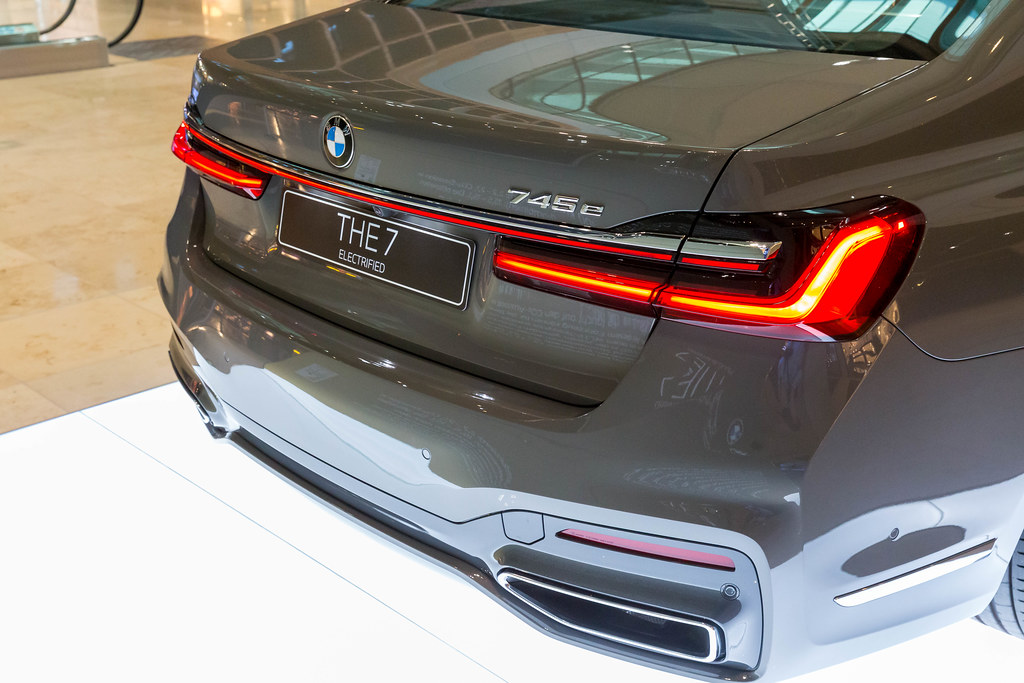 THE 7 Electrified: the BMW 745e Plug-in-Hybrid limousine, view of the back part at BER airport