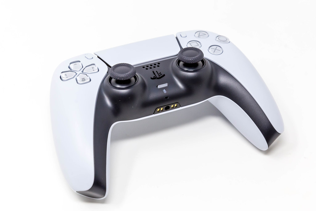 White and Black Sony PlayStation 5 DualSense Wireless Controller on White Background