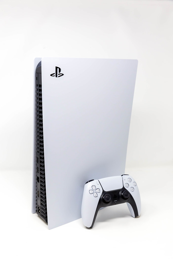 Standing Sony PlayStation 5 with the new DualSense Wireless Controller on White Background