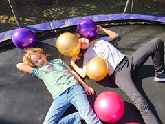 Everett And Grace On The Trampoline With Balloons