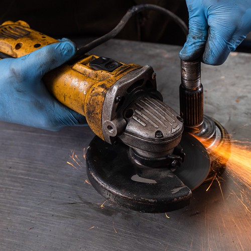Ind. NBR RB35 - 3-young-man-welder-blue-gloves-grinder-metal-angle-grinder-workshop-sparks-fly-side_square