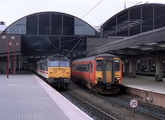 class 156s in "Strathclyde red" in England