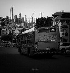 Bus driving down Potrero Hill during golden hour