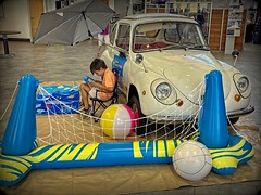 Shot in an auto dealership showroom while car shopping. The car is a Subaru 360, made by Subaru from 1958 to 1971, Fort Worth, July 17, 2023
