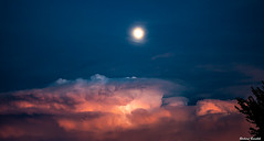 Storm, sunset, lightning and the moon