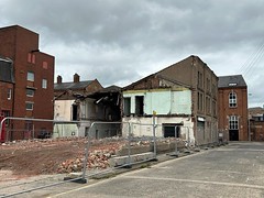 Demolition underway behind the former archives building