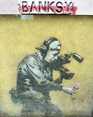 banksy's camera man and flower