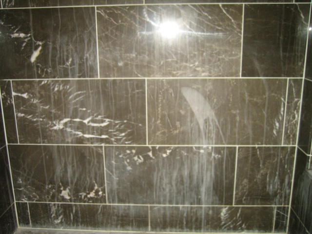 Damaged-Etched-Marble-On-Wall