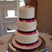 Three tiered wedding cake with topper