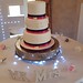 3 tiered wedding cake with lace embellishments