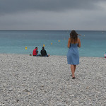 Girl on a Pebble Beach by John Reddington