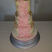 Three tiered semi naked cake with a cascade of dusky pink hydrangeas