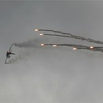 F16 with Anti Missile Flare by John Russell