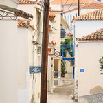 Blue and white street in Poros