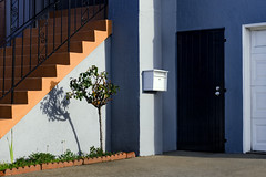 Blue House with Orange Stairs