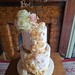 Abstract two tiered iced with textured buttercream pipped, fresh flowers & topper