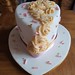 Iced heart with pipped buttercream roses and abstract sprinkles