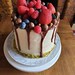 Chocolate drip buttercream cake laden with fresh fruits