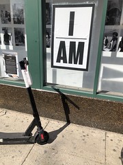 I AM: photography exhibit sign with scooter, Columbia Road NW, Columbia Heights, Washington, D.C.