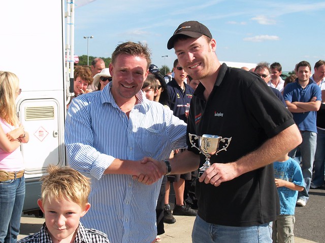 Wayne Ashford receives trophy from Simon Griffiths