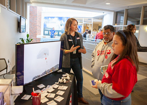 CIMMS Researcher Kimberly Hoogewind speaking to two people at the National Weather Festival in 2019. (Photo by Emily Jeffries, CIMMS/NSSL)