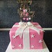 Pink present box birthday cake with topper