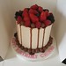 Chocolate drip buttercream birthday cake with soft fruits