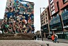 People walking past a painted (graffiti) wall in London. This image is provided on an as-is basis, royalty free for personal editorials, blogs and web display usage. - Royalty Free Urban Landscape