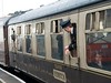 Steam train carriages with conductor and boy waving. This image is provided on an as-is basis, royalty free for personal editorial, blog and web display usage. - Royalty Free Trains, Planes & Automobilies