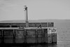 Man resting on the seawall Torquay Pier. This image is provided on an as-is basis, royalty free for personal editorial and web display usage only. - Royalty Free Seascape & Boating Images