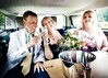 Man and two women drinking chapmpagne in the back of a limo. This image is provided on an as-is basis, royalty free for personal editorial, blog and web display usage. - Royalty Free People & Candid Situations