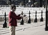Man performing tricks on Torquay harbourside. This image is provided on an as-is basis, royalty free for personal editorial, blog and web display usage. - Royalty Free People & Candid Situations