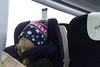 Girl wearing a beany sleeping on train. This image is provided on an as-is basis, royalty free for personal editorial, blog and web display usage. - Royalty Free People & Candid Situations