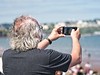 Torbay Airshow Images. Spectator on the beach near Painton Pier watching the display. Image courtesy and copyright Dave Collerton - Torbay Airshow 2016 - 2019