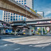 Thai-Japanese Bridge on Rama IV road with BTS Skytrain passing above in Bangkok, Thailand