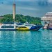 Harbor with ferry boats and cruise ships in Singapore