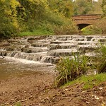 Bridge and waterfall in Buckingham by Raymond Poulter
