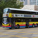 Citybus 8825 (XS 7853) on route 79X is passing by Sham Shui Po sport ground for Fanling after leaving Tonkin Street West bus terminus .