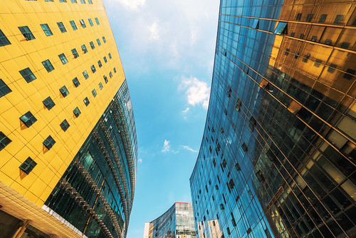 Modern corporate buildings against blue sky