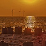 North sea windmills & crumbling castles at sunset by Colin Buck