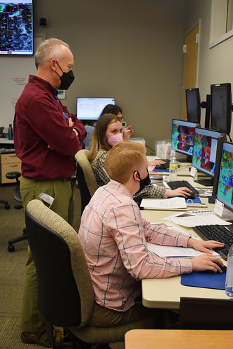 Jim LaDue, a scientist from the National Weather Service, instructs meteorologists during the Radar and Applications Course (RAC) on April 18, 2022, at the National Weather Center in Norman, OK. The flagship course allows forecasters to practice issuing severe storm warnings in a simulated environment.
