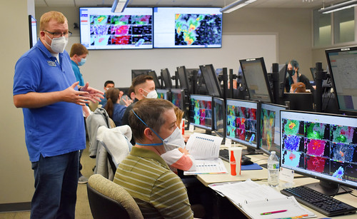 Justin Gibbs, a scientist from the National Weather Service, instructs meteorologists during the Radar and Applications Course (RAC) on April 18, 2022, at the National Weather Center in Norman, OK. The flagship course allows forecasters to practice issuing severe storm warnings in a simulated environment.