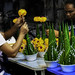 Making flower arrangements in the flower market district in Bangkok, Thailand.  436a