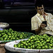 Man selling lime in the flower market district in Bangkok, Thailand.  451a