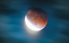 Super Flower Blood Moon Lunar Eclipse through the Clouds